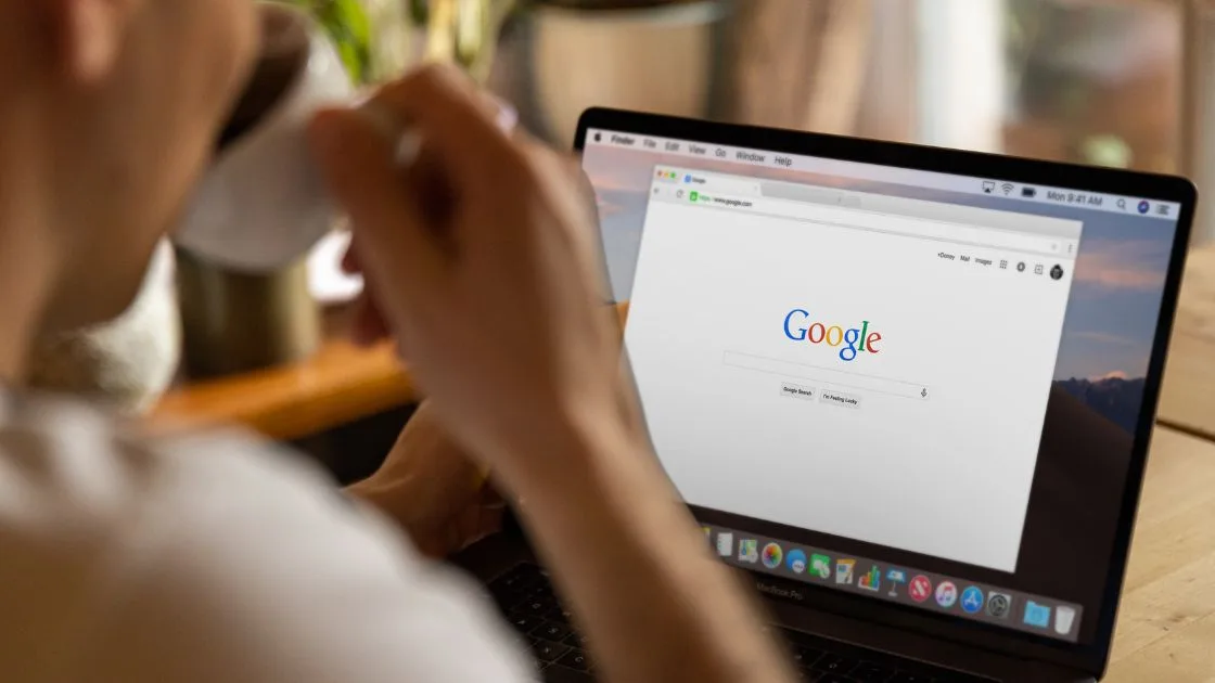 Small business owner in Akron updating their Google Business Profile on a laptop